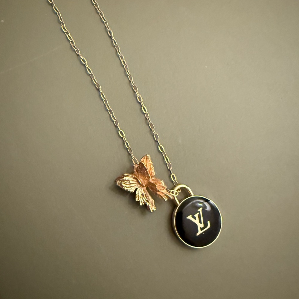 Authentic Louis Vuitton Black and Gold Pendant on a Gold Filled Necklace